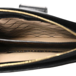 Reverse Monogram Trunk Clutch