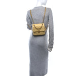 Shiny Caviar Quilted Chain Melody Backpack Yellow