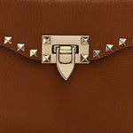 Pebbled Calfskin Rockstud Flip Lock Top Handle Bag Cognac