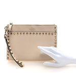 Pebbled Calfskin Rockstud Wristlet Clutch White