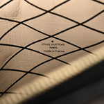 Reverse Monogram Trunk Clutch
