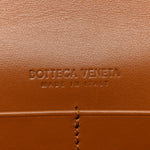 Suede Intrecciato Andiamo Pouch On Strap Amber