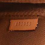 Monogram Pochette Wristlet