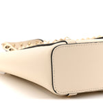 Pebbled Calfskin Rockstud North South Crossbody Bag Light Ivory