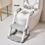 Children's potty seat with step stool attached to a toilet in a bathroom setting.