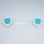 Two white contact lens cases with blue bear faces on a light gray background