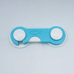 Blue and white fidget spinner on a light gray background
