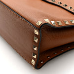 Pebbled Calfskin Rockstud Flip Lock Top Handle Bag Cognac
