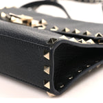 Pebbled Calfskin Medium Rockstud Flip Lock Crossbody Bag Black
