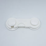 White suction cup on a light gray background