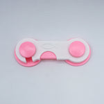 Pink and white fidget spinner on a light gray background