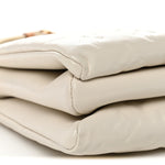 Lambskin Embossed Monogram Coussin PM Cream