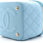 Caviar Quilted Top Handle Vanity Case With Chain Blue