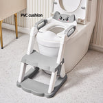 Children's potty seat with step stool attached to a toilet, featuring a PVC cushion.