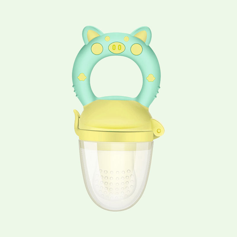 Children's fruit feeder with pig design on a light green background