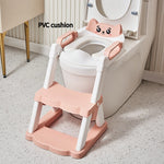 Children's potty training seat with pink cushion and white steps next to a toilet.